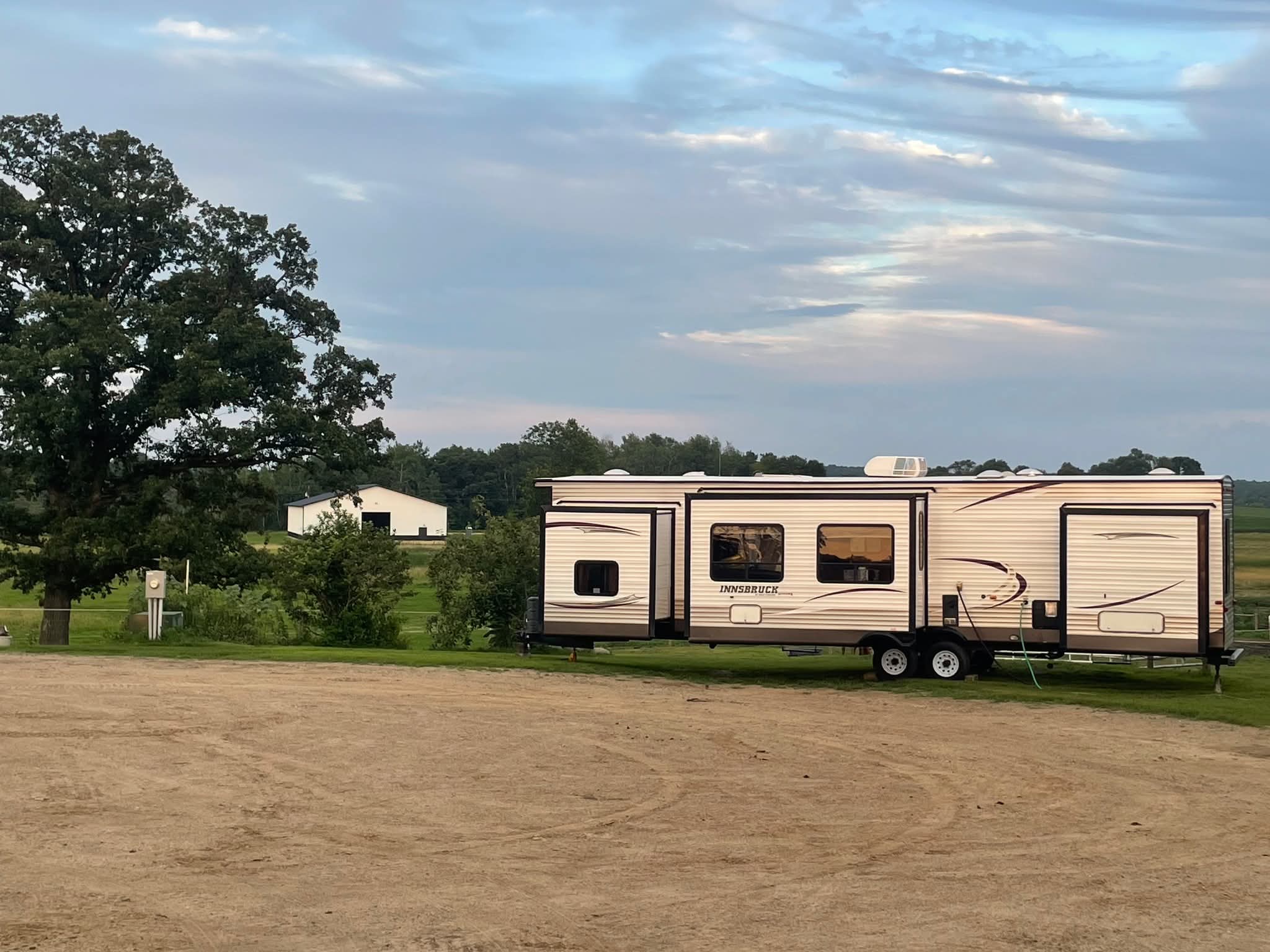 RV parked on site at Yahweh Ranch at dusk